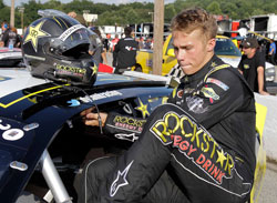 NASCAR K&N Pro Series West racer Dylan Kwasniewski climbs into his Rockstar Energy/Royal Purple #98 Chevy Impala at Greenville Pickens Speedway