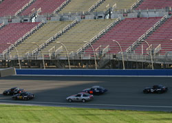 Pearlman working his way through the combined Pro-7/Miata field going into turn one on the NASCAR oval.