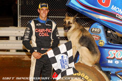 Justin Henderson poses with his mascot after winning a the Season Finale at the Williams Grove Speedway at Mechanicsburg, Pennsylvania.