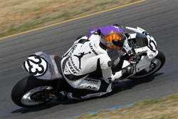 Ben Nostrom knee drags on his #23 Michael Jordan Motorsports Suzuki GSXR-1000 race bike