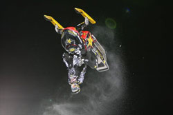 Backflip at Winter X-Games 15 for the Bomb Squad Battalion Racing Team