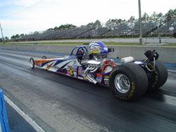 Robbie Officer and the 2007 OFFICER BOYZ half scale Advanced Jr. Dragster ready for track action
