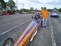 15 year old Advanced Jr. Dragster Driver Robbie Officer and father Mark Officer focus on the upcoming race