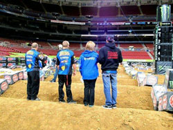 2011 Team Manager Award winner, Christina Denny and part of her team walk the track at St. Louis Supercross. Photo by Vurbmoto.