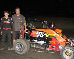 Cody and Kirk Swanson with their GOODWINE glass, K&N Filters, Lucas Oil Ford Focus Midget