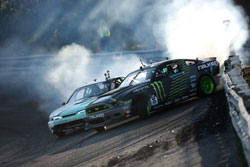 Vaughn Gittin Jr. was sweeping the bank and scraping the wall, leaving his rear bumper in the blue tire smoke on route to victory.